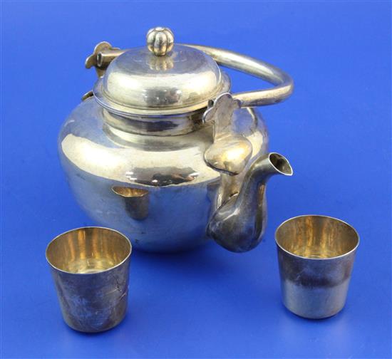 A 20th century Japanese silver teapot and 2 similar tots, gross 10.5 oz.